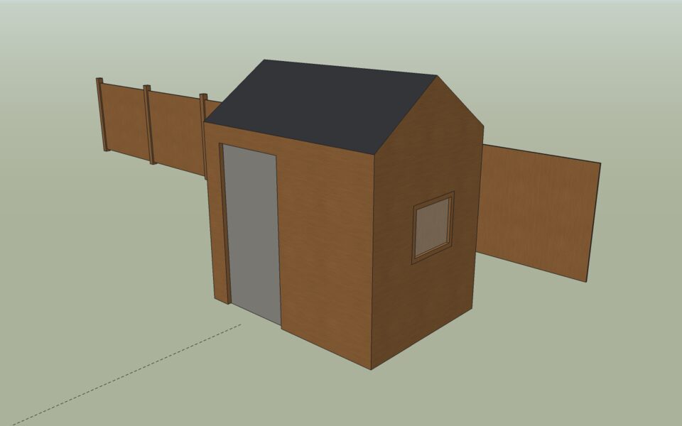 The painted shed: wood cladding, a charcoal roof, a grey door and a glass pane.
